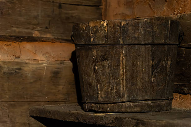 istock A wooden bucket sitting on a shelf 2226050365