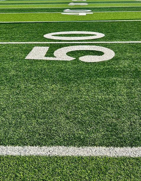 istock 50 yard line on football field 2226052302