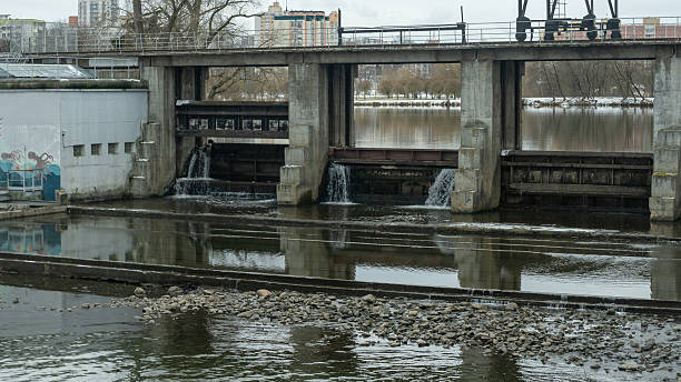 istock A winter scene of a river dam, showcasing the engineering marvel controlling water release. The icy landscape highlights the dam's role in managing water flow and preventing flooding. 2226057863