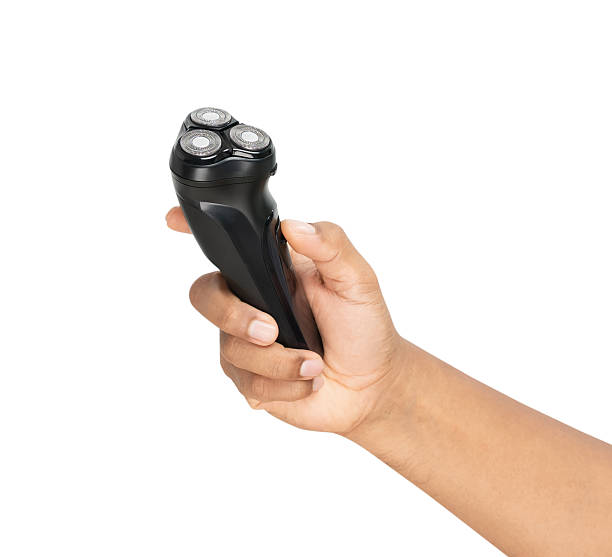 istock Hand holding electric shaver on isolated background, Clipping path. 2226061589