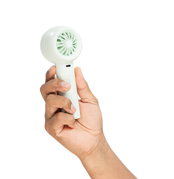 istock Man holding small portable fan on isolated background, Clipping path. 2226061659