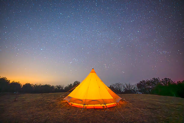 istock Outdoor camping tent under the stars 2226064576