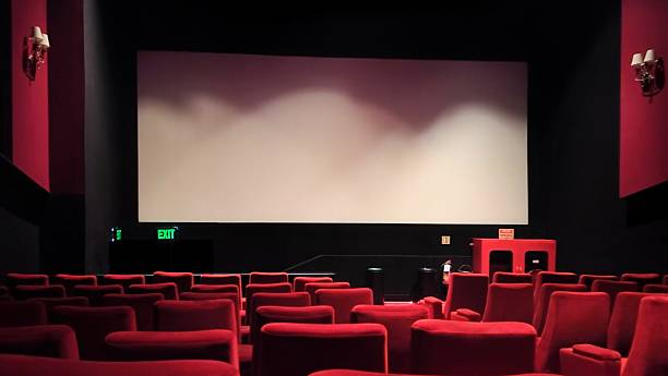 istock Empty movie theater with big screen and seats 2226071584