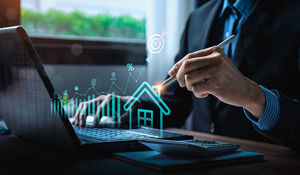 istock Businessman using digital pen on laptop analyzing real estate investment with AI technology, housing market trend, property value growth, mortgage rate forecast, and financial data for smart planning 2226072779