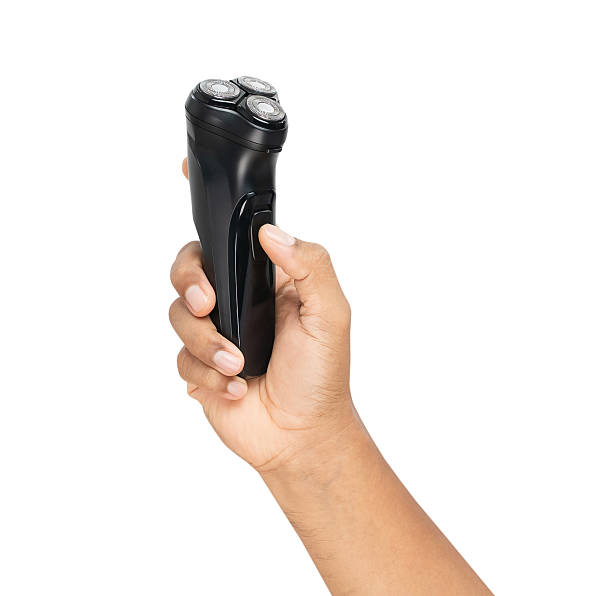 istock Hand holding electric shaver on isolated background, Clipping path. 2226075843