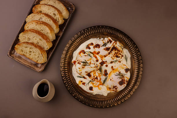 istock Cilbir or Turkish Eggs is Poached Eggs With Creamy Yogurt and Butter Sauce. 2226080314