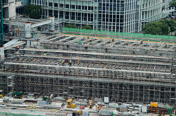 An aerial perspective showcasing a construction site located in a bustling city.