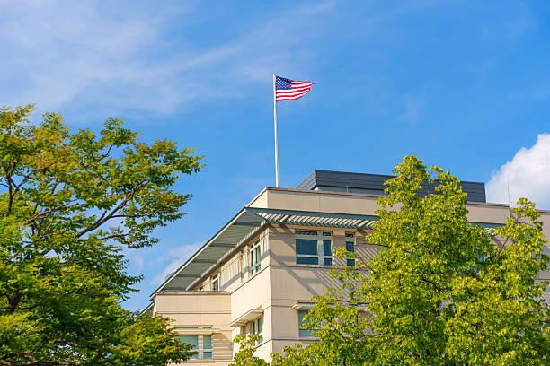 istock Modern Building With American Flag Under Clear Blue Sky 2226093189