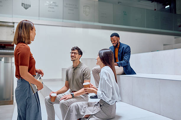 istock Young Professionals Enjoying Coffee Break in Modern Office Space 2226095873