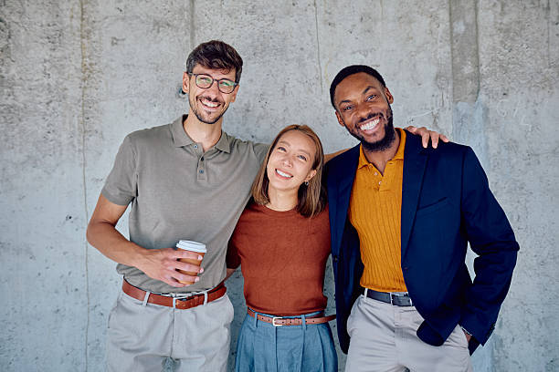 istock Startup businesspeople smiling with arms around each other during coffee break 2226096156