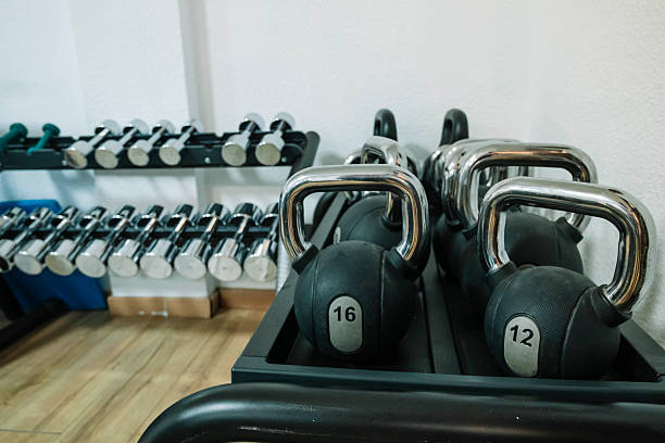 istock A row of dumbbells and a kettlebell are on a rack. 2226096187