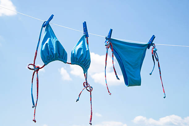 istock Swimsuit hanging on a line to dry 2226098355