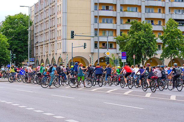 Berlin, Germany - June 1, 2025: Crowd of cyclists at a traffic light in Berlin, showcasing vibrant urban life and eco-friendly transportation.