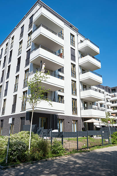 istock Modern white multifamily residential building 2226099582