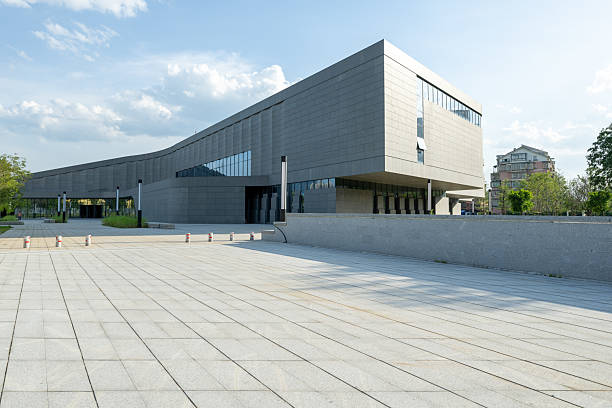 An empty marble square in front of modern architecture