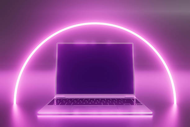 istock A laptop is on a table with a purple background 2226101154