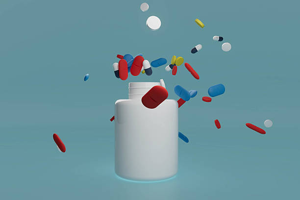 istock A white pill bottle with pills falling out of it 2226101794