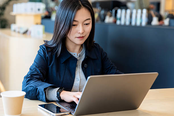 istock An Asian professional woman working in a cafe 2226108615