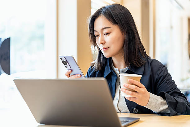 istock An Asian professional woman working in a cafe 2226108645