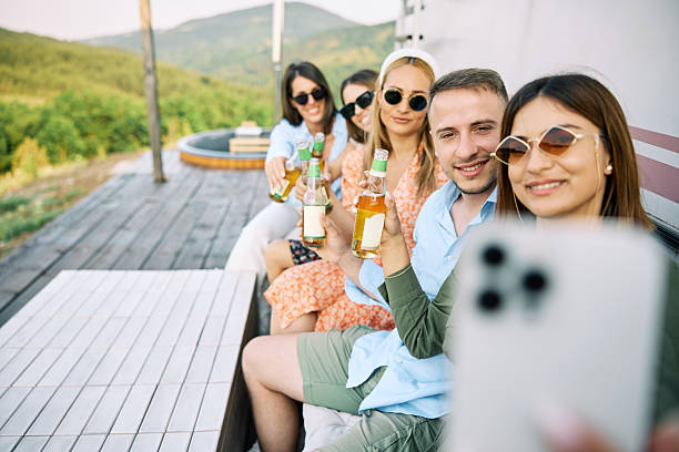 istock Friends Enjoying Relaxed Vacation Outdoors with Drinks 2226109051