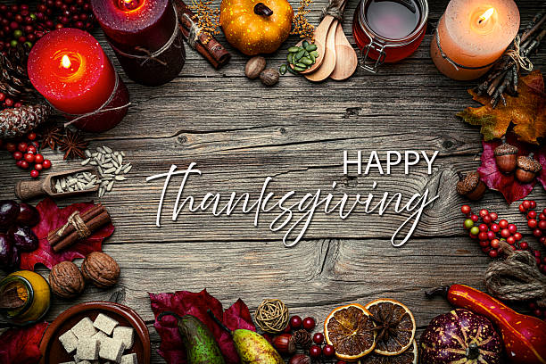 istock Autumn or Thanksgiving border. Decor with burning candles, fallen leaves, nuts, cinnamon sticks and pumpkin. Greeting card or copy space. October or season. Happy Thanksgiving 2226110561