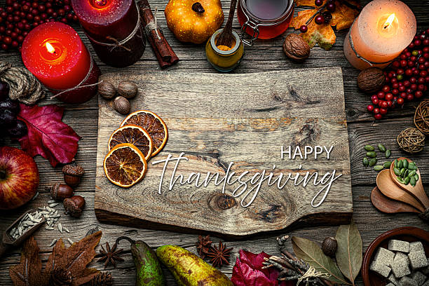 istock Autumn or Thanksgiving border. Decor with burning candles, fallen leaves, nuts, cinnamon sticks and pumpkin. Happy Thanksgiving greeting card. October or season. 2226110566