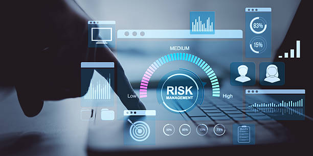 istock Businessperson using laptop with digital risk management dashboard interface and finance charts on light background in modern fintech concept. 2226112511