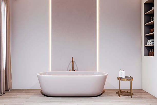 istock Elegant modern bathroom interior with freestanding bathtub, soft lighting, and minimalist decor in bright clean space with wooden flooring. 3D Rendering 2226112570