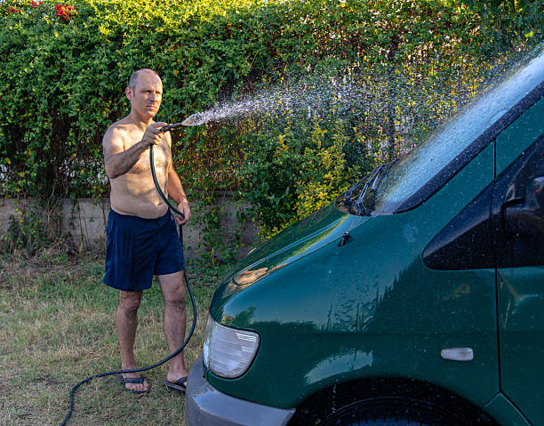 istock Man washing the van at sunset 2226117069