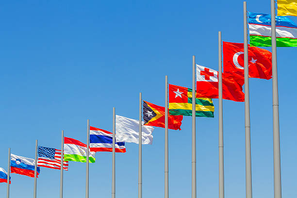istock flags of countries against blue sky 2226120346
