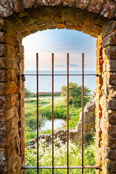 istock View through a barred opening of the Hammerhus ruins 2226120930