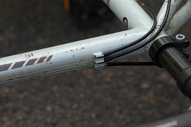 This is a detailed closeup view showcasing a bicycle frame along with its handlebars, highlighting the craftsmanship involved in its design