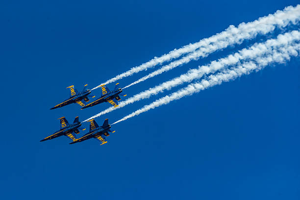The Blue Angels, also referred to as the U.S. Navy Flight Demonstration Squadron, four Boeing FA-18 Super Hornet jets flying in formation against a clear blue sky at an air show at the Naval Air Facility,  El Centro, California.  Photography date: March 16, 2019.