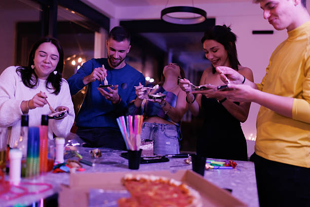 Group of Friends Enjoying a Jubilant Get-Together with Food and Fun