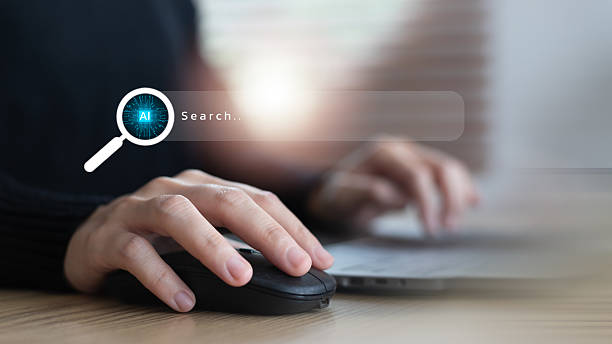istock Close-up hand using a mouse with an AI search icon on a virtual screen. Concept of artificial intelligence, smart search engine, machine learning, and digital innovation. 2226134477