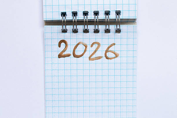 istock Spiral notebook with squared text 2026 written in brown paint as a concept of planning, goals, strategy and ideas 2226138158