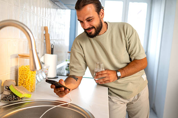 istock I'm drinking water at home and texting you 2226140060
