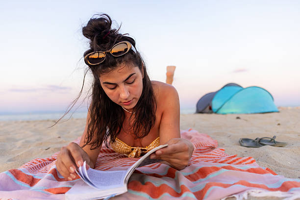 istock Young female nomad finding peace by the sea 2226140544