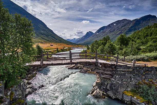 istock Old wooden bridge over river Leira in Jotunheimen 2226149728