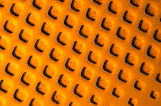 a graphics image of raised squares with a burnt orange hue and dark shadows
