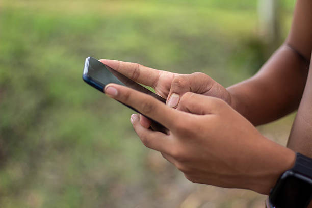 istock A man holds a mobile phone, and the background is blurred 2226152585