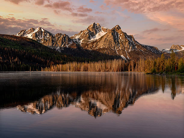 istock Sunrise morning clouds reflection with mountain peak 2226157244