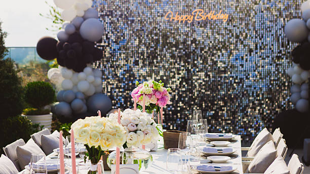 istock Featuring a dazzling sequin backdrop with a Happy Birthday neon sign, elegant table settings, 2226158275