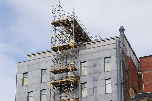 istock External lift hoist at modern high rise flats being constructed 2226160113