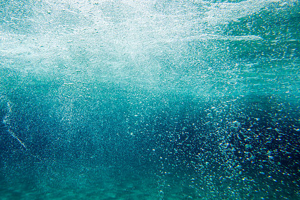 istock Underwater air bubbles in a dark blue sea 2226160929