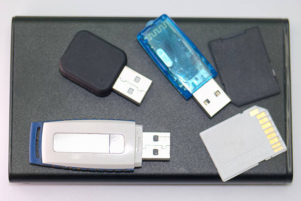 istock Various types of USB drives and memory cards on a black surface arranged for easy access and organization 2226161197
