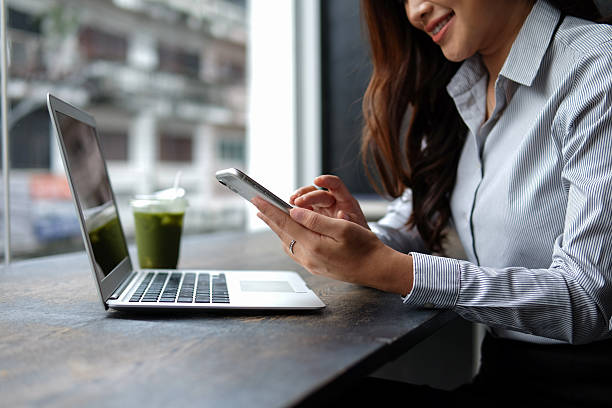 istock A woman's hand holding a phone and communicating via the internet. 2226162421