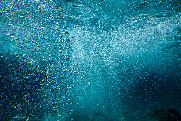 istock Underwater air bubbles in a dark blue sea 2226162507