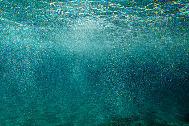 istock Underwater air bubbles in a dark blue sea 2226162543