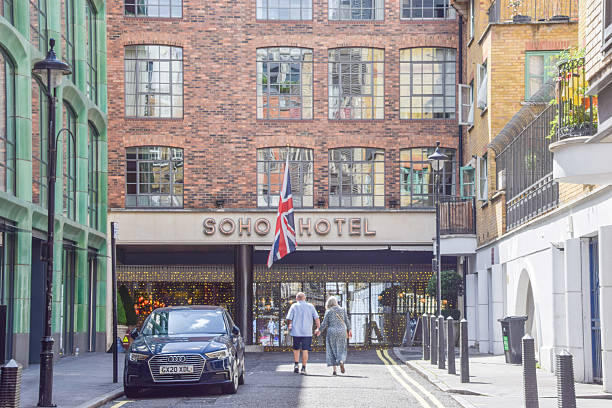 London, UK - July 20 2025: exterior view of Soho Hotel with people walking outside.